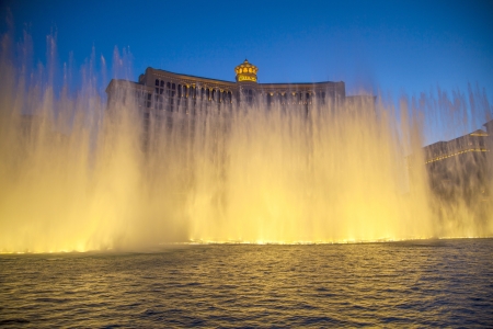 LAS VEGAS - JUNE 15: Las Vegas Bellagio Hotel Casino, featured with its world famous fountain show, at night with fountains on June 15, 2012 in Las Vegas, Nevada.のeditorial素材