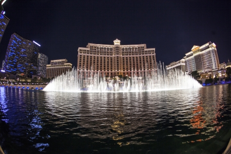 LAS VEGAS - JUNE 15: Las Vegas Bellagio Hotel Casino, featured with its world famous fountain show, at night with fountains on June 15, 2012 in Las Vegas, Nevada.のeditorial素材