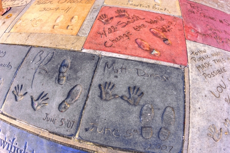 LOS ANGELES - JUNE 26: Matt Demon and Will Smith's handprints in Hollywood Boulevard on June 26,2012 in Los Angeles. There are nearly 200 celebrity handprints in the concrete of Chinese Theatre's forecourt.のeditorial素材