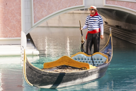 LAS VEGAS - JUNE 15: Gondolieres at The Venetian Resort Hotel & Casino on June 15, 2012. The resort opened on May 3, 1999 with flutter of white doves,  singing gondoliers and actress Sophia Loren.のeditorial素材