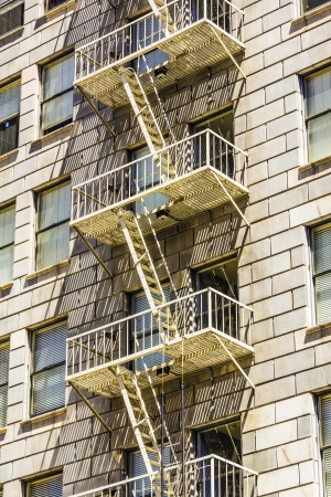 facade of historic skyscraper downtown Los Angeles with fire escape stairsのeditorial素材