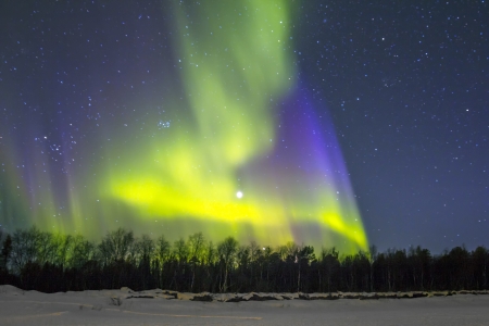 Northern Lights (Aurora borealis) over snowscape.の写真素材