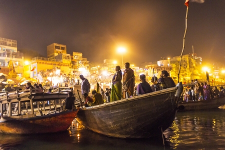 VARANASI - INDIA, MAY 4: Hindu watches the ceremony of ritual washing from the boat  in the holy city of Varanasi. The holy ritual of washing is held every day on May 4,2012 in Varanasi, India.のeditorial素材