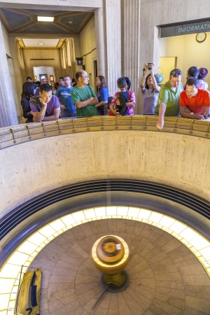 LOS ANGELES, CA - JUNE 10: people admire the Foucault pendulum in Griffith park on June 10,2912 in Los Angeles. The pendulum was installed in 1935  to demonstrate the rotation of the Earth.のeditorial素材