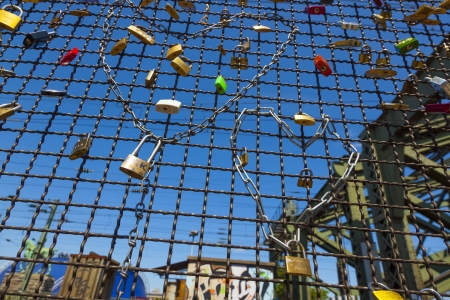 COLOGNE, GERMANY - MAY 11. lockers at the  Hohenzollern bridge symbolize love for ever on May 11,2011 in Cologne, Germany. It is the most heavily used railway bridge in Germany and used by pedestrians in love.のeditorial素材