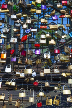 COLOGNE, GERMANY - MAY 11. lockers at the  Hohenzollern bridge symbolize love for ever on May 11,2011 in Cologne, Germany. It is the most heavily used railway bridge in Germany and used by pedestrians in love.のeditorial素材