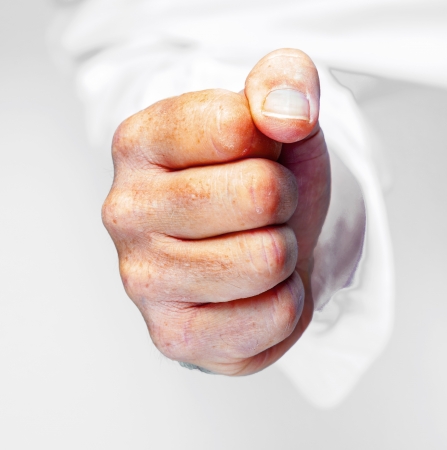 detail of male fist in white business shirtの写真素材