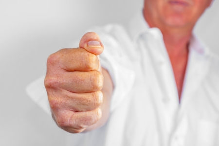 detail of male fist in white business shirtの写真素材