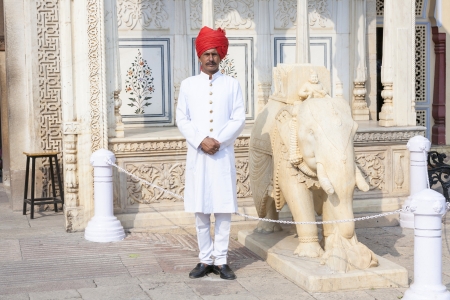 JAIPUR, INDIA - OCTOBER 19: Indian welcome from unidentified guard in typical indian dress of the City Palace on October 19, 2012 in Jaipur, Rajasthan, India.のeditorial素材