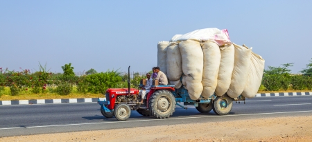 RAJASTHAN, INDIA - FEB. 24: timber transport with tractor on country road on Feb. 24, 2010 in Rajasthan, India.のeditorial素材