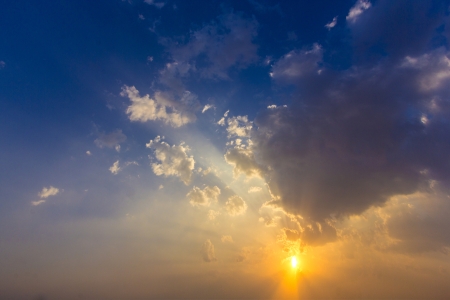 spectacular golden sunset with cloudsの写真素材