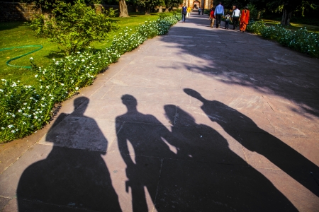 shadows of family visiting a landmark in Delhi, Indiaの写真素材