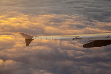 wings of aircraft in sunrise