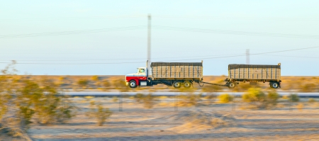 GILA BEND, USA - JULY 11: truck on interstate 8 in early morning at July 11, 2012 in Gila Bend, USA. I-8 was part of the original 1957 plan of Interstates, following US 80 from San Diego to Gila Bend.のeditorial素材