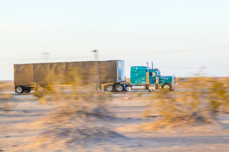 GILA BEND, USA - JULY 11: truck on interstate 8 in early morning at July 11, 2012 in Gila Bend, USA. I-8 was part of the original 1957 plan of Interstates, following US 80 from San Diego to Gila Bend.のeditorial素材