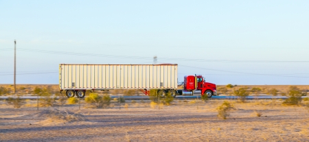 GILA BEND, USA - JULY 11: truck on interstate 8 in early morning at July 11, 2012 in Gila Bend, USA. I-8 was part of the original 1957 plan of Interstates, following US 80 from San Diego to Gila Bend.のeditorial素材