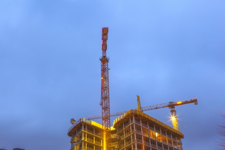 HAMBURG, GERMANY - JANUARY 20: at the construction site at the Reeperbahn in Hamburg they work 24 hours daily to finalize the new skyscraper on Jan 20, 2011 in Hamburg, Germany.のeditorial素材