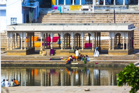 PUSHKAR, INDIA - OCT 20: people at rituell washing  in the holy lake on Oct 20,2012 in Pushkar, India. A ritual bath in the  Lake is considered to lead one to salvation.のeditorial素材