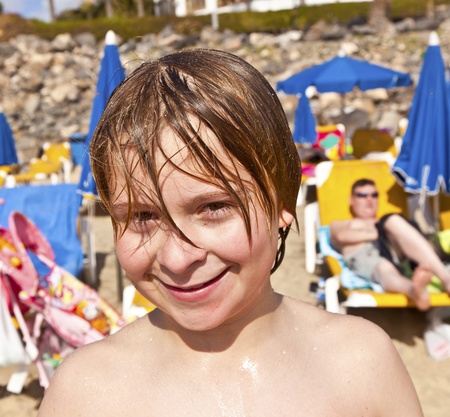 cute boy has fun at the beachの写真素材