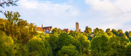 Rothenburg ob der Tauber, old famous city from medieval times seen from the romantic valley of the river Tauberの写真素材