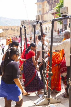 AMER, INDIA - OCT 19: indian women queue up for entrance to the yearly Navratra Festival on Oct 19,2012 in Amer, India. During the festival elephant ride is stopped due to the mass of people.のeditorial素材
