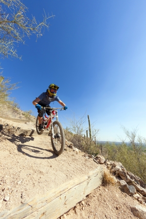 TUSCON, USA - JUNE 11: downhill bike rider in TUSCON, USA on June 11, 2012.  There are around 1,000 bicycle related deaths in the United States each year, 75% of which are due to head injuries.のeditorial素材