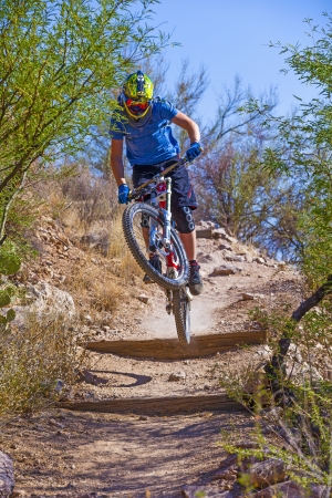 TUSCON, USA - JUNE 11: downhill bike rider in TUSCON, USA on June 11, 2012.  There are around 1,000 bicycle related deaths in the United States each year, 75% of which are due to head injuries.のeditorial素材
