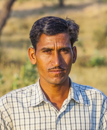 MANDAWA, INDIA, OCT 25: farmer poses in front of his cows on OCT 25 in  Mandawa, India.  There are over 280 MILLION cows in India. Thats more than a quarter of the entire world population.のeditorial素材