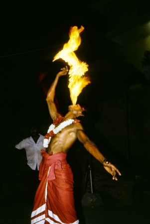 KANDY, SRI LANKA -  JULY 7: fire-eater performance for tourists on July 7,1985 in Kandy, Sri Lanka. The Kandyan Dance Performance group shows different kind of traditional dances.のeditorial素材