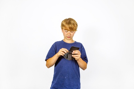 boy is checking the pocket money in his purse