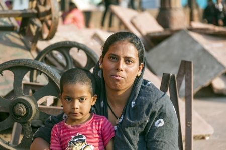 DELHI, INDIA - NOV 8: mother with child rests on the courtyard of Jama Masjid Mosque in Delhi on Nov 8,2011. Jama Masjid is the principal mosque of Old Delhi in India.のeditorial素材