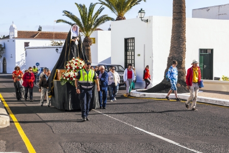 YAIZA, SPAIN - MARCH 30: easter procession with holy Mary on March 30, 2013 in Yaiza, Spain. The centrepiece of every procession is the Virgin Mary, exquisitely decorated.のeditorial素材