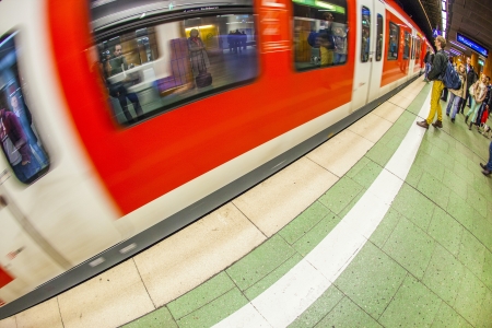FRANKFURT, GERMANY - APR 12: people wait at the metro station for the arriving train on Apr 12,2013 in Frankfurt, Germany. The Metro station was inaugurated 1978 after 8 years under construction.のeditorial素材