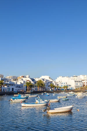ARRECIFE , SPAIN - MAR 31: people anchor the boats in Charco de San Gines on MAR 31,2013 in Arrecife, Spain. The harbor area was remodelled by Canarian architect Caesar Manrique in 1984.のeditorial素材