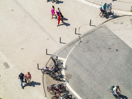 people walking at the street with long shadowsのeditorial素材
