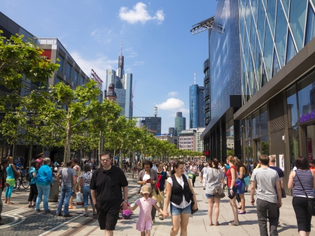 FRANKFURT, GERMANY - JUNE 8: people walk along the Zeil in Midday on June 8,2013 in Frankfurt, Germany. Since the 19th century it is of the most famous and busiest shopping streets in Germany.のeditorial素材