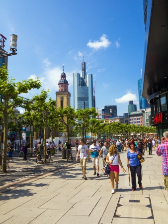 FRANKFURT, GERMANY - JUNE 8: people walk along the Zeil in Midday on June 8,2013 in Frankfurt, Germany. Since the 19th century it is of the most famous and busiest shopping streets in Germany.のeditorial素材