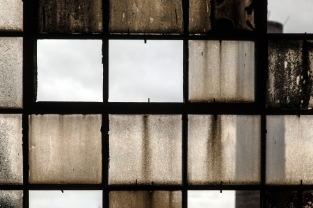 pattern of old broken industry window gives a harmonic backgroundの写真素材