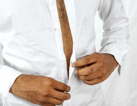 man buttoning his shirtの写真素材