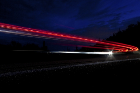 car light on interstate in mountain desert  landscape in Arizona