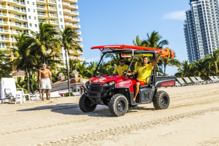 MIAMI BEACH, USA - JULY 28: lifeguards return at 6pm on July 28, 2013 in Miami Beach, USA. Beach patrol became existing in 1926. Since that time the  Ocean Rescue division guards the beach in Miami.のeditorial素材