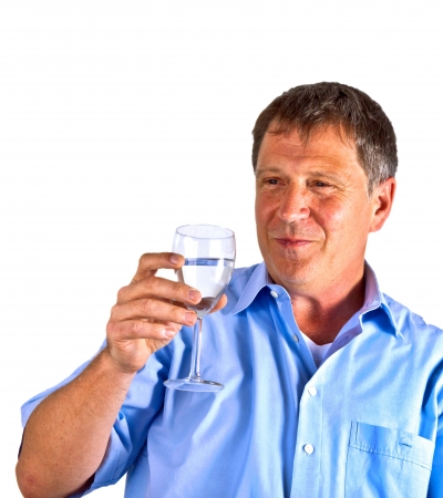 thirsty man drinking out of a wine glassの写真素材