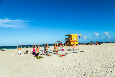 MIAMI, USA - JULY 31  people enjoy the fitness course on July 31, 2013 in Miami, USA  South beach ios famous for its wooden lifeguard towers which are designed in Art deco style のeditorial素材