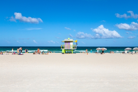 MIAMI, USA JULY 31  Tourists on beach enjoying sun on July 31, 2013 in South Beach Miami, situated just across the famous Art Deco District Strip のeditorial素材