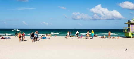 MIAMI, USA JULY 31  Tourists on beach enjoying sun on July 31, 2013 in South Beach Miami, situated just across the famous Art Deco District Strip のeditorial素材