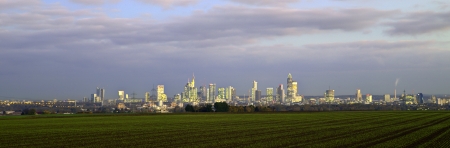 skyline of Frankfurt by night with clouds and skyscraperの写真素材