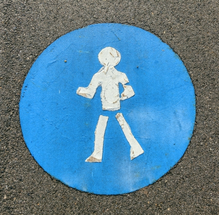 symbol for pathway and icon for pedestrians on asphaltの写真素材