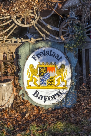 old enamel plate with insignia of the Freistaat Bayern in sunriseのeditorial素材