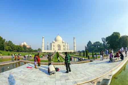AGRA, INDIA - NOV 16: Unidentified tourists visit the marble mausoleum Taj Mahal on November 16,...