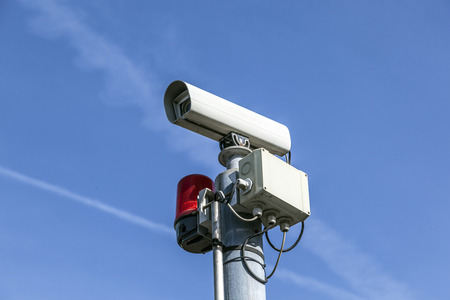 CCTV security camera under blue sky
